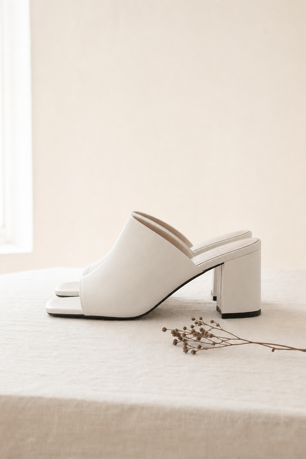 Flattered white block heel mule