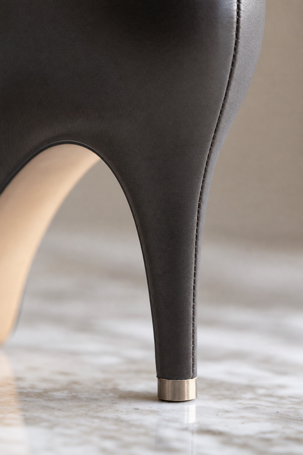 Precision stiletto heel tip on marble